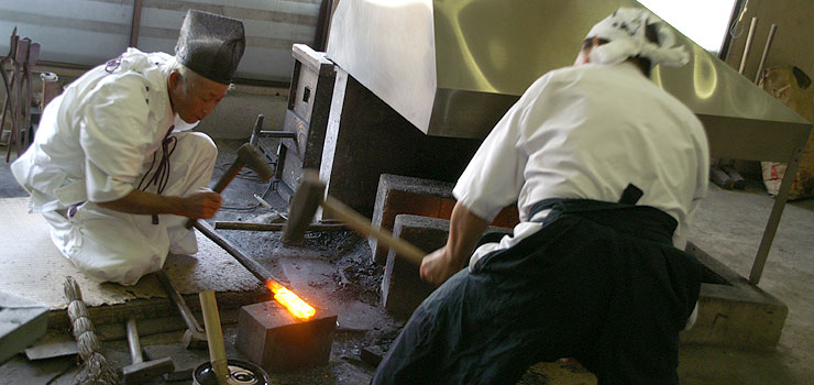 Sword making masters forging a new katana in Seki.